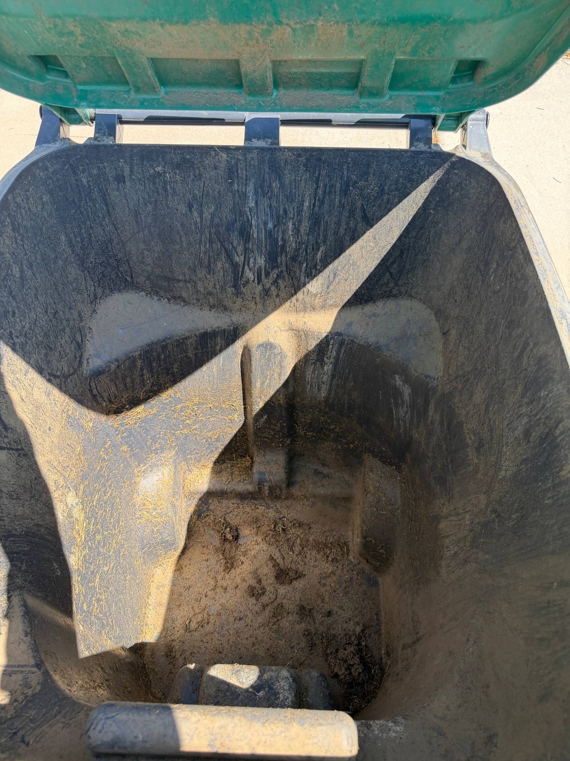Before: dirty trash bin interior
